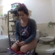 A pretty, plump, Eastern-European girl takes a shit and a piss right after sitting down on a toilet. Plops are loud and clear. Camera is positioned a distance away. Over 8 minutes.